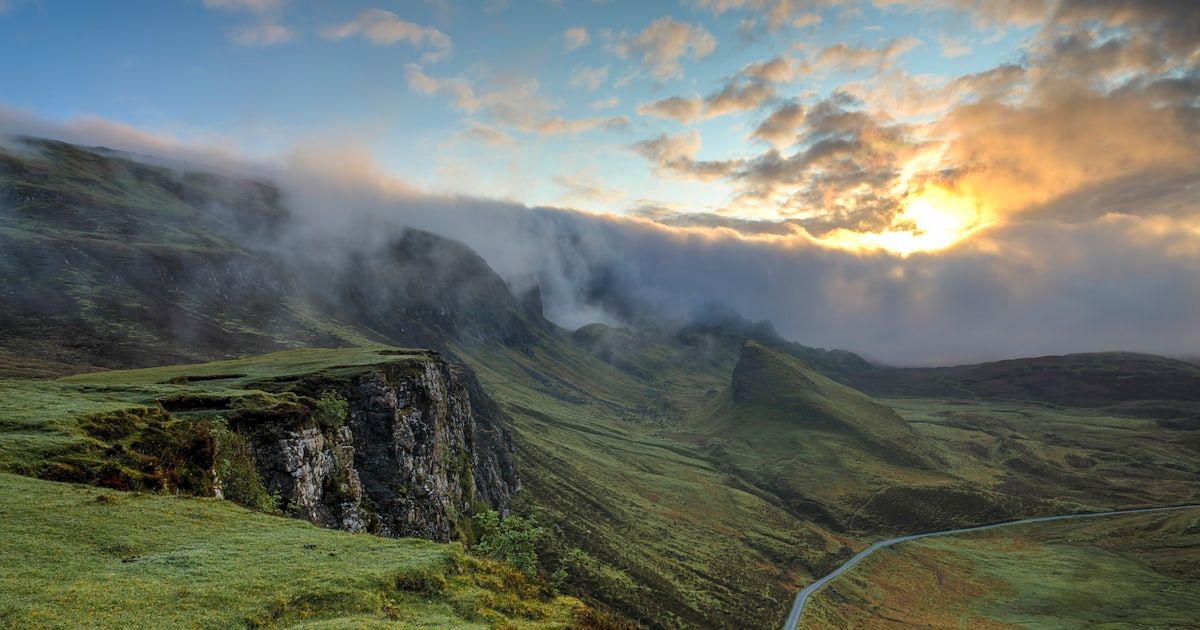 Peaceful mountain valley in morning mist